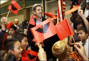John Kerry, pictured surrounded by black-and-red flags